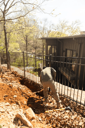 Commercial property lawn installation utilizing premium Landscape Drainage Solutions in Atlanta to redirect heavy stormwater runoff away from building foundations.